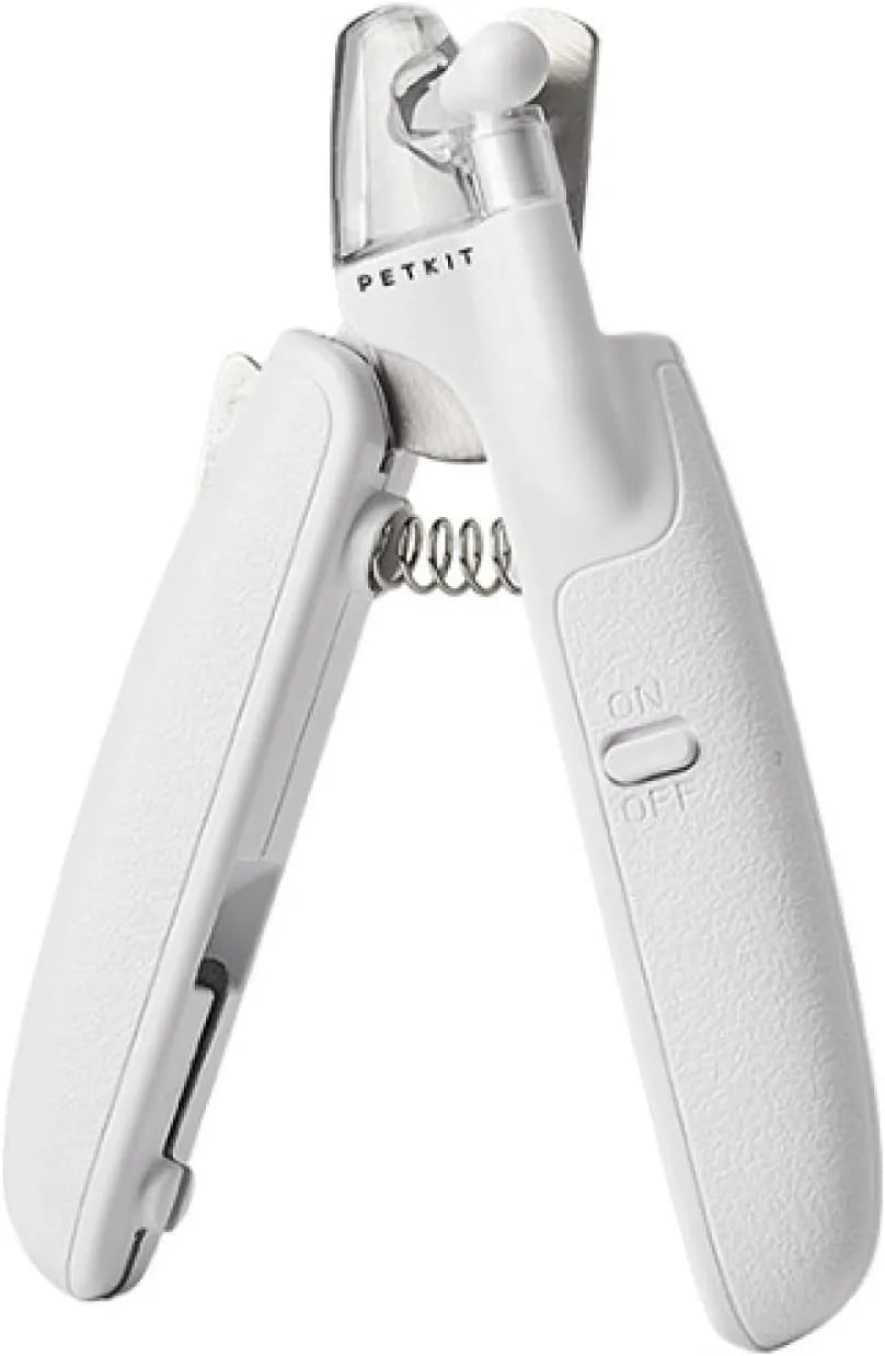 White pet nail clippers with LED light, transparent anti-splash guard, and integrated nail file on a grey background.