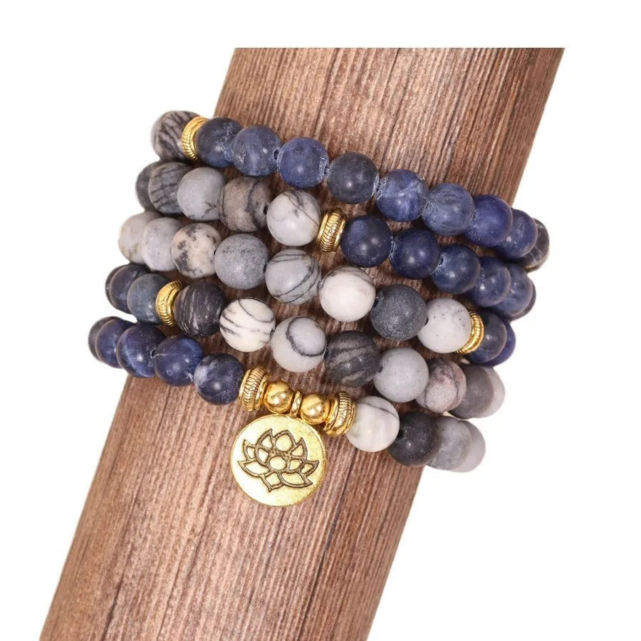 Blue patterned network stone beads on a multi-layer alloy bracelet in a natural style.