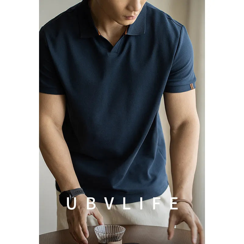 American-style short-sleeved polo shirt in a cotton-polyester blend, shown in blue, black, or white.