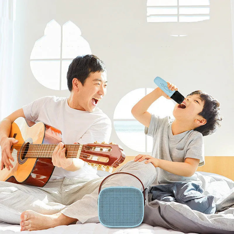 Compact Bluetooth portable speaker with microphone in white, pink, or blue colours showing USB port