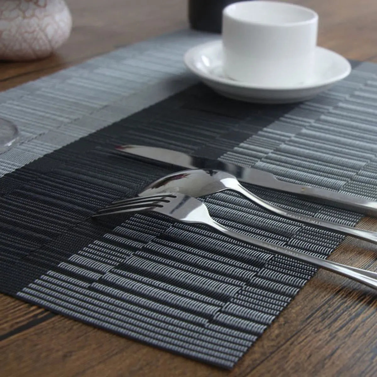 PVC non-slip place mat in Gradient Bamboo black colour on a kitchen counter