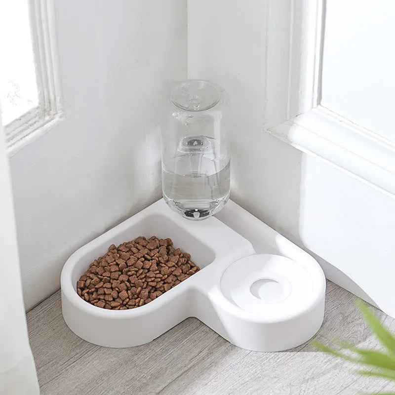 White pet water fountain with stainless steel top, showing water flowing from the centre.