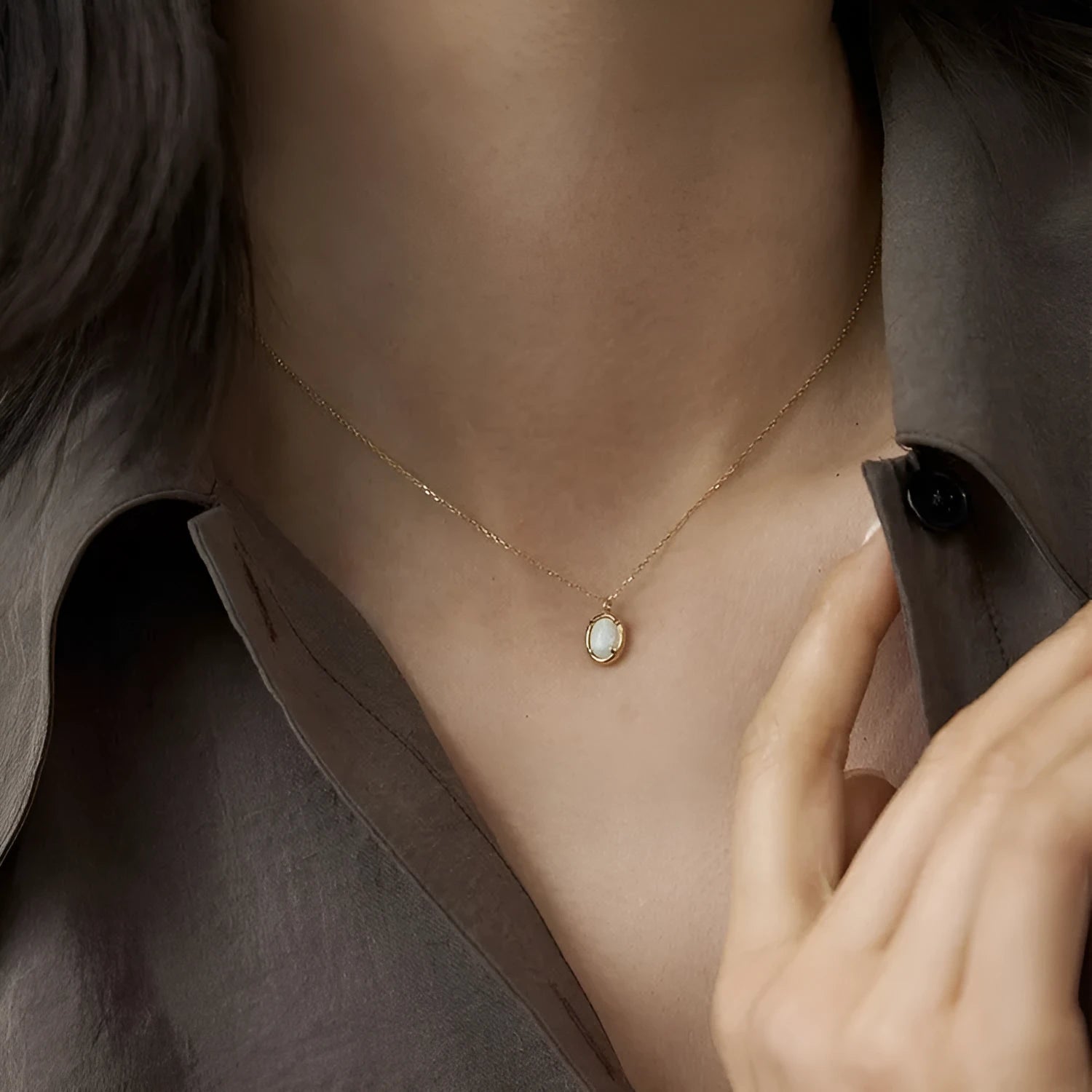 Oval S925 silver pendant necklace with a round jelly opal, shown in both gold tone and white gold tone finishes.