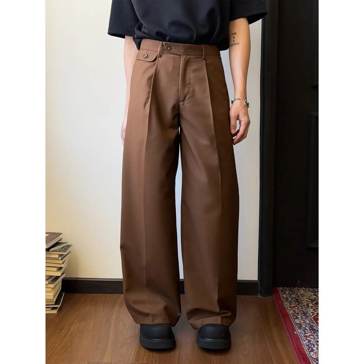 Men's straight-leg suit trousers in brown with wide-leg fit showing front and side views.