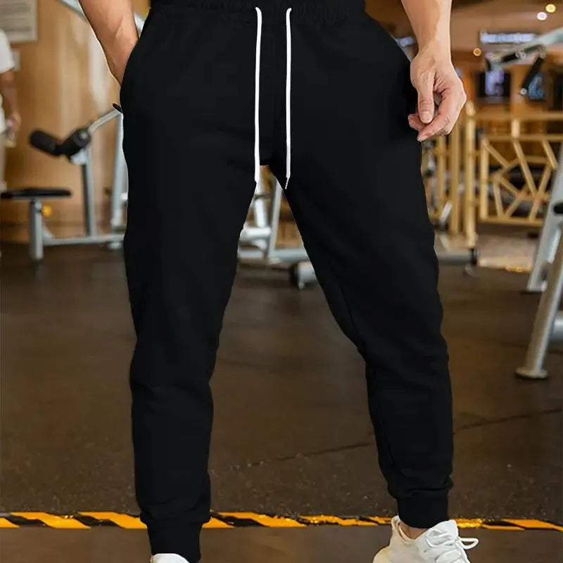 Men's linen leisure trousers with elastic drawstring waist in thin polyester fabric, loose fit design