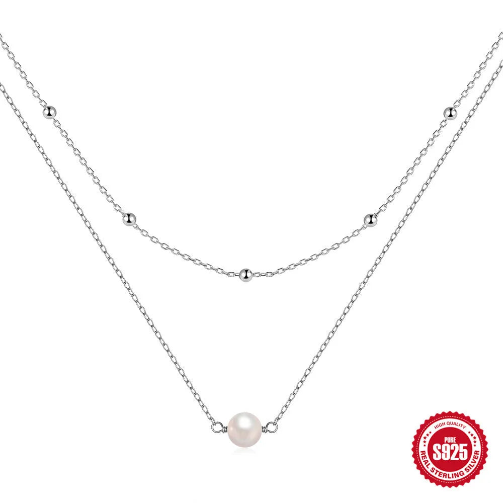 Sterling silver double layer necklace with twin pearls and geometric pendant in gold colour