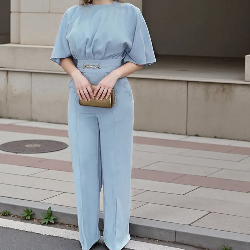 Men's blue polyester two-piece suit with long sleeve jacket and trousers on a hanger.