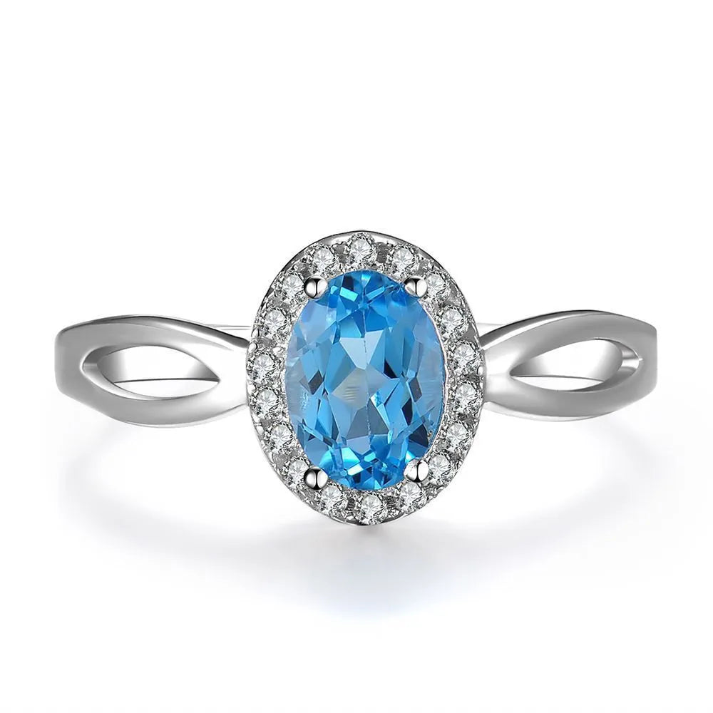 925 sterling silver geometric jewellery set with blue topaz gemstones including earrings, ring, pendant and necklace