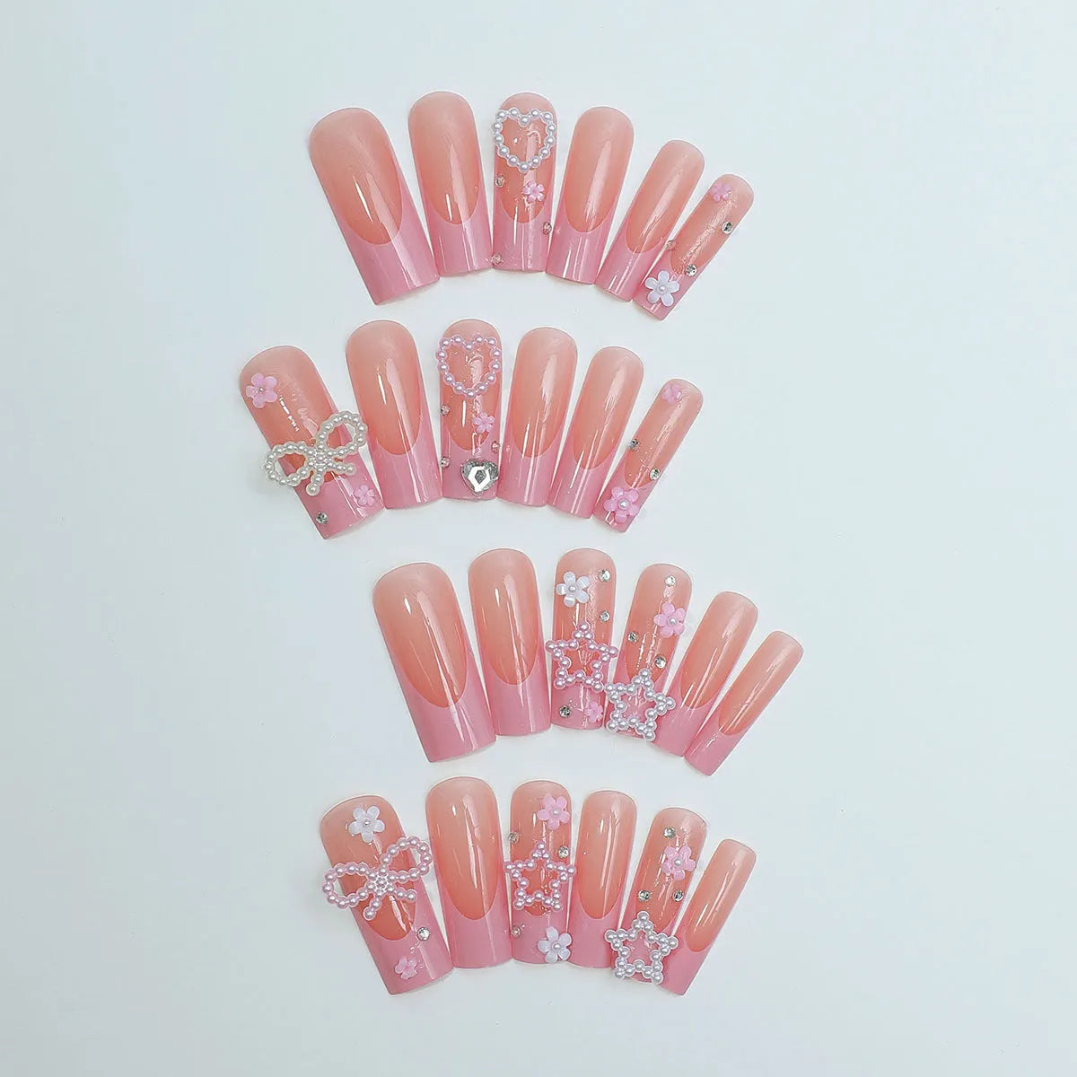 Super long water pipe shaped false nails with French spot and drill bow design in XB-70-48 pink.