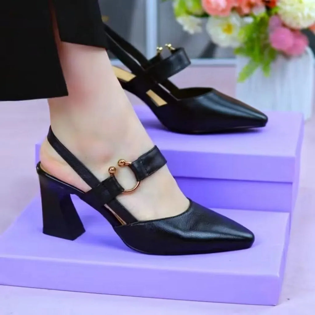Women's apricot coloured closed toe leather mule sandals with a chunky block heel.