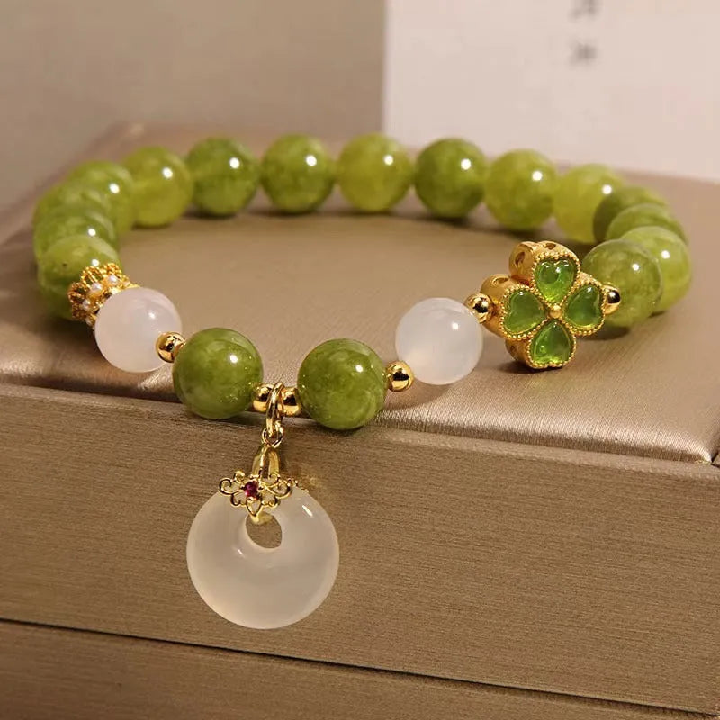 Women's green tourmaline bracelet with a four-leaf clover safety buckle in New Chinese style.