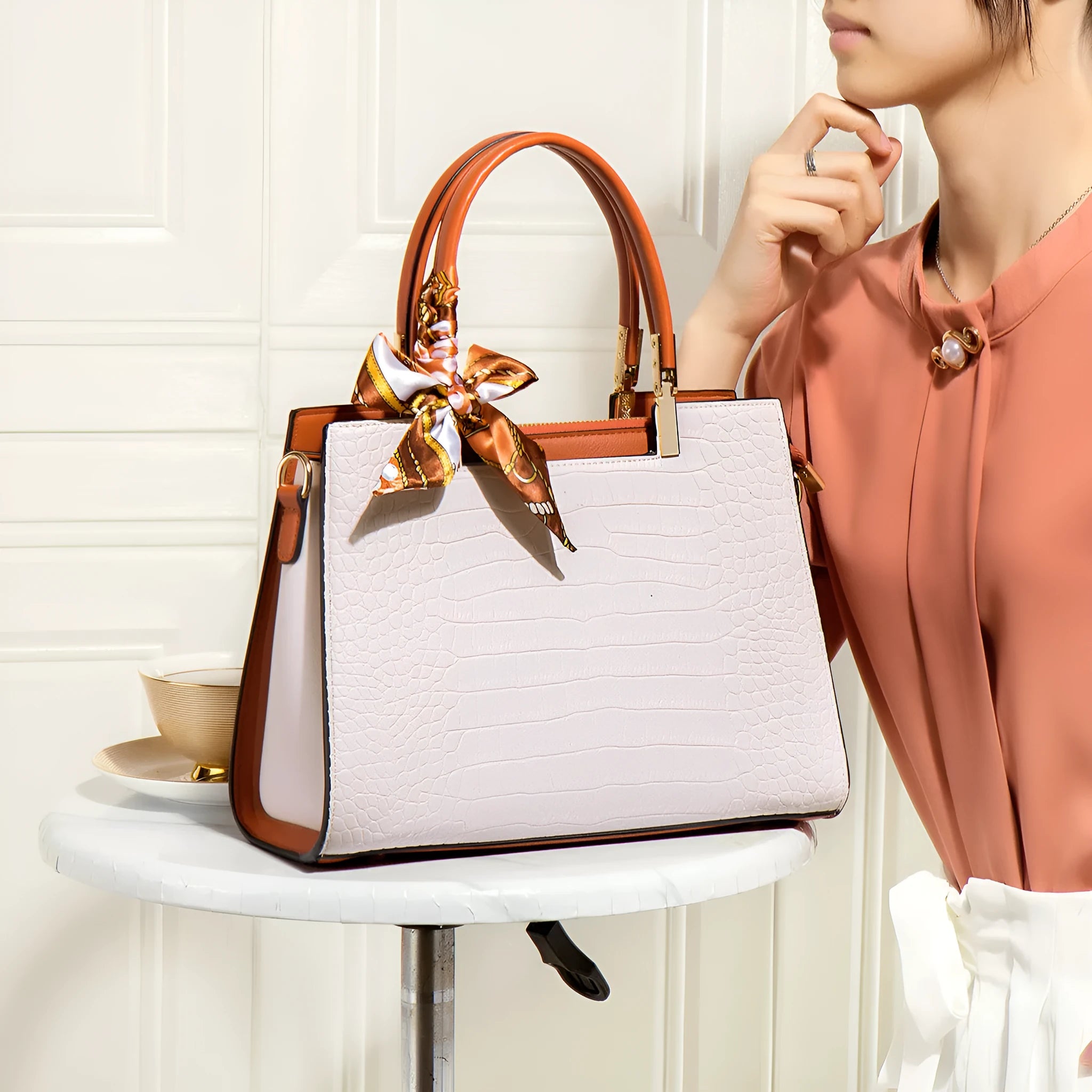 Milky white women's large-capacity PU shoulder handbag with internal organisers and slit pocket.