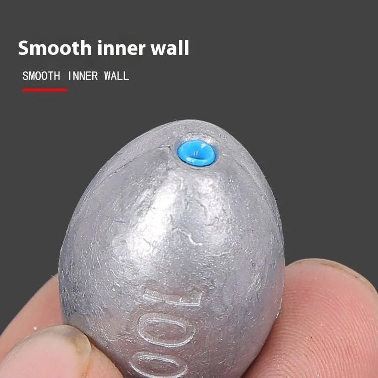 Tongxin olive-shaped lead fishing sinker with scale markings, showing rugby shape and plastic core construction.