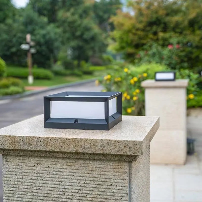 White aluminium solar-powered LED outdoor column light for wall or garden mounting.