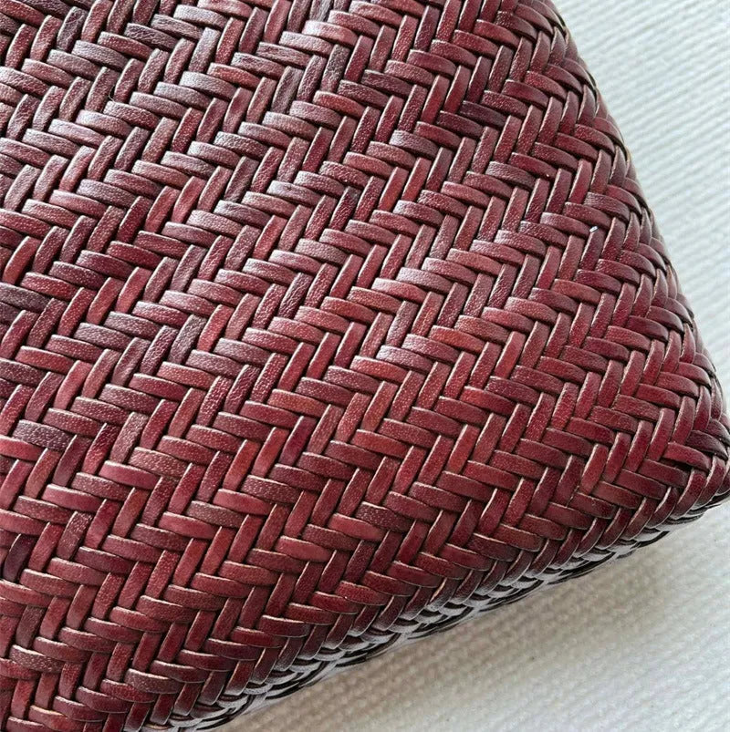 Brown woven leather tote bag with three-dimensional pockets measuring 27cm high by 30cm wide