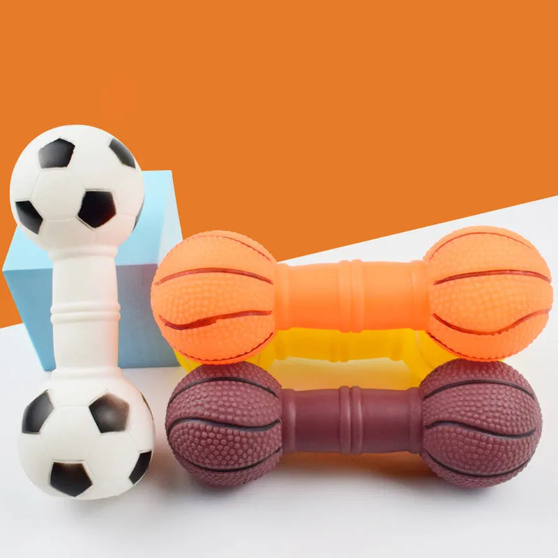 Brown, orange, white, and yellow PVC football dumbbell shaped dog squeaky toy on a white background.