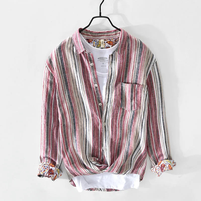 Grey striped linen shirt with long sleeves on male model showing loose casual fit