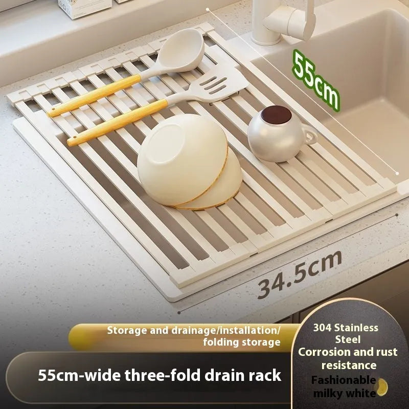 Foldable milky white stainless steel kitchen draining rack beside a sink