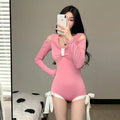Women's long sleeve one-piece swimsuit in polyester available in pink or black colours