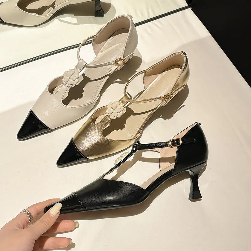 Women's gold stiletto shoe with flower buckle decoration and pointed toe design on sheepskin upper