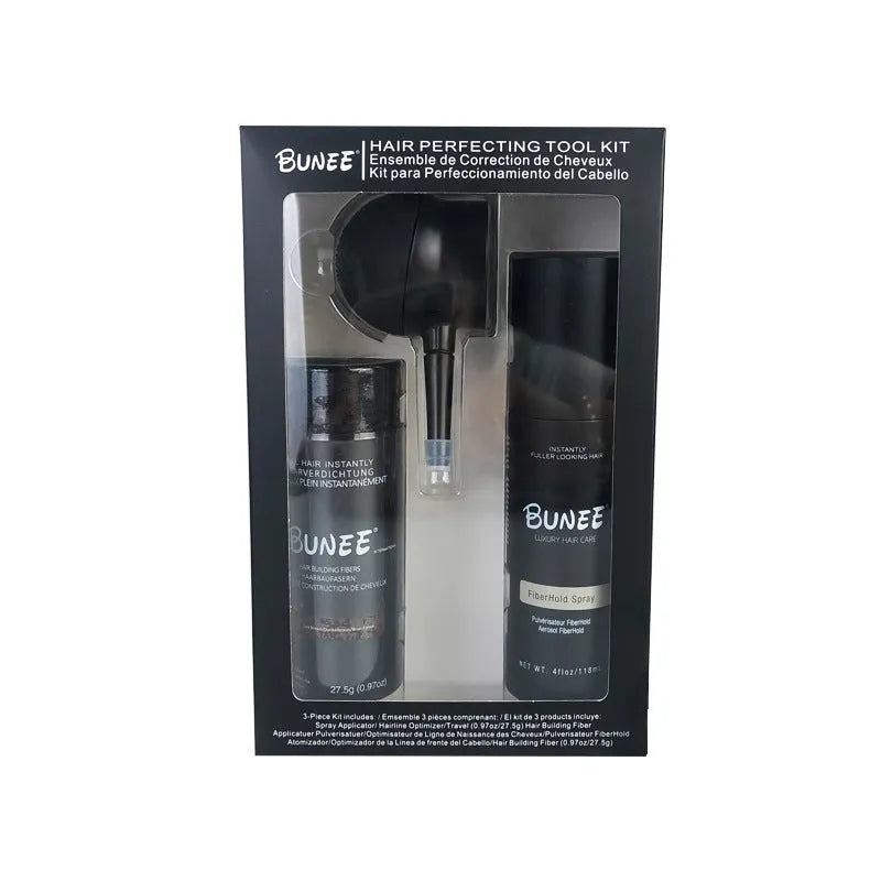 Canister of hair thickening fibre powder with nozzle and bottle of styling spray for thinning hair