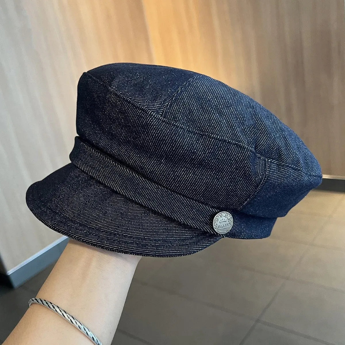 Dark blue denim newsboy hat with adjustable sizing and optional contrasting brim colours