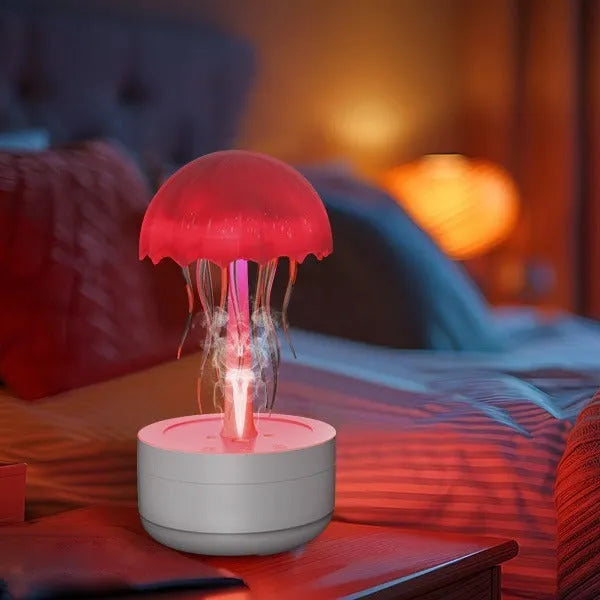 White jellyfish-shaped humidifier and essential oil diffuser with colourful night light on wooden desk