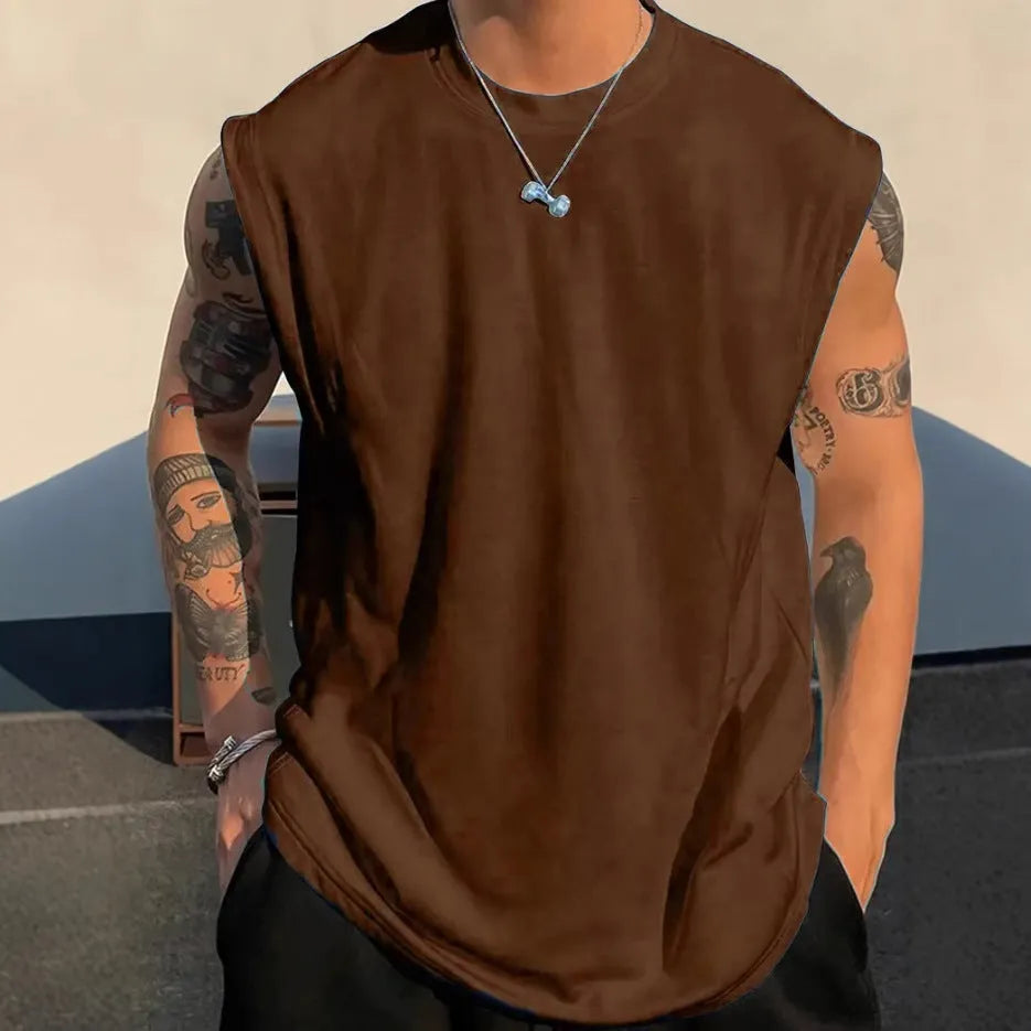 Men's loose fit solid colour cotton sleeveless t-shirt on a hanger, shown in apricot.
