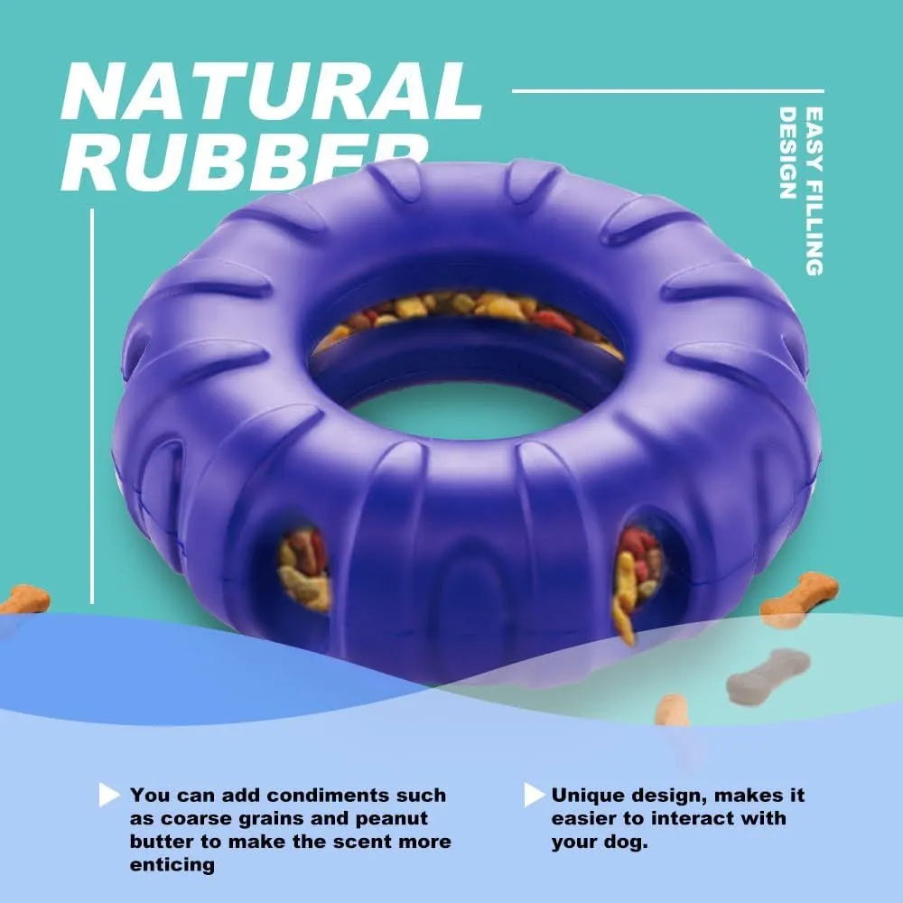 Blue rubber tyre-shaped dog chew toy with oval openings for treat dispensing