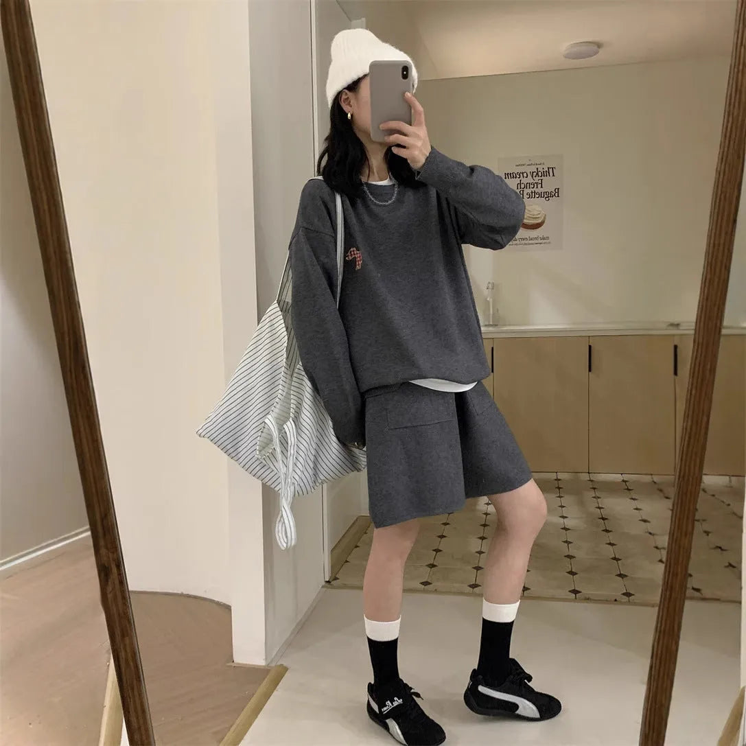 Women's milk blue casual knitted sweater and shorts suit with animal pattern embroidery.