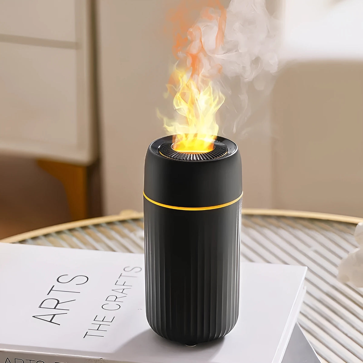Black and white car aroma diffuser with simulation flame effect on a car console.