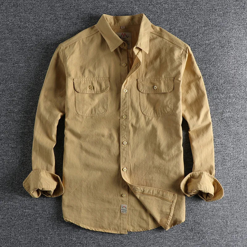 Men's solid colour cotton shirt with cardigan style collar in light blue, showing long sleeves and regular fit