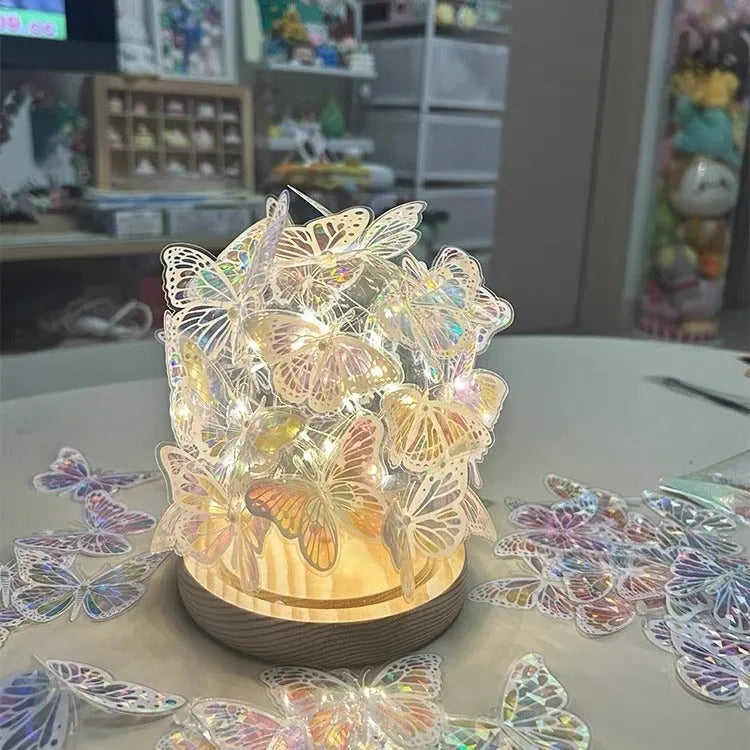 Handmade butterfly-shaped DIY night lamp with glass shade and raw wood base, 12cm by 15cm.
