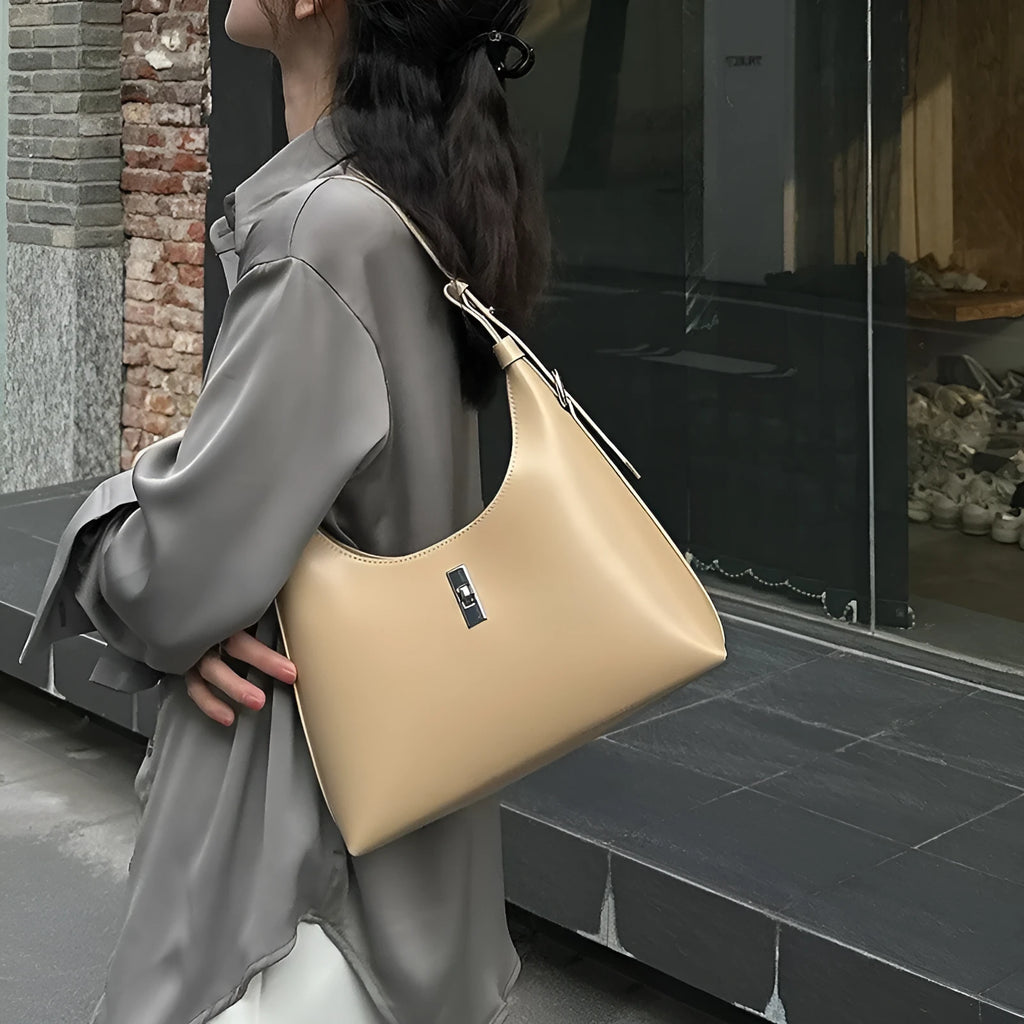 Genuine leather dumpling-shaped crossbody bag with shoulder strap and multiple pockets