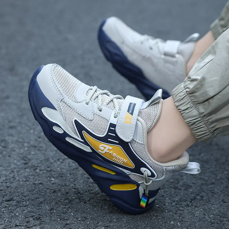 Boys' dark blue and black platform sports shoes with Velcro strap and mesh upper.