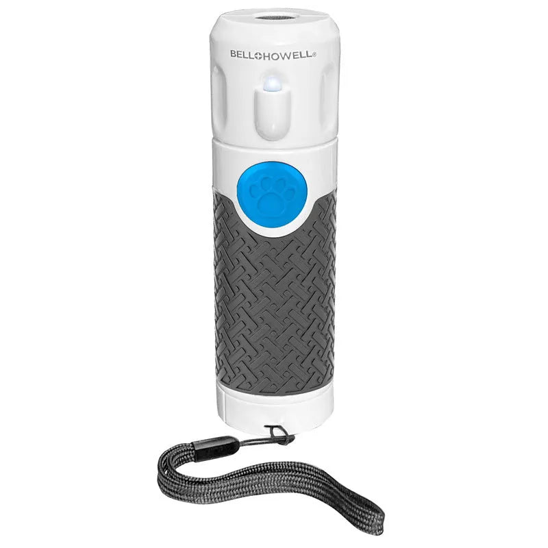White handheld ultrasonic dog bark control trainer on a plain background.