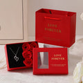 Six scented soap flowers in red pink or black inside a gift box with matching handbag
