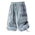 Men's loose-fit cargo shorts with plaid stitching detail in black, grey, or smoky grey.