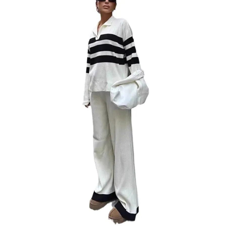 Women's black and white striped knitted two-piece set with polo collar top and matching trousers