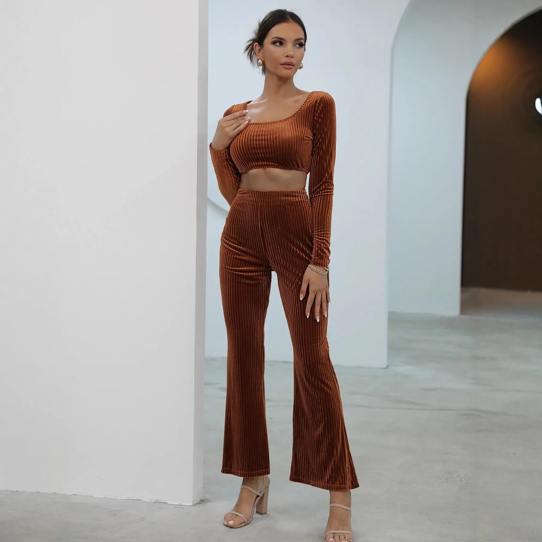 Caramel coloured long sleeve sweater and matching trousers casual set laid flat