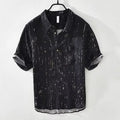Men's loose-fit short-sleeve polo shirt cardigan in black, laid flat.