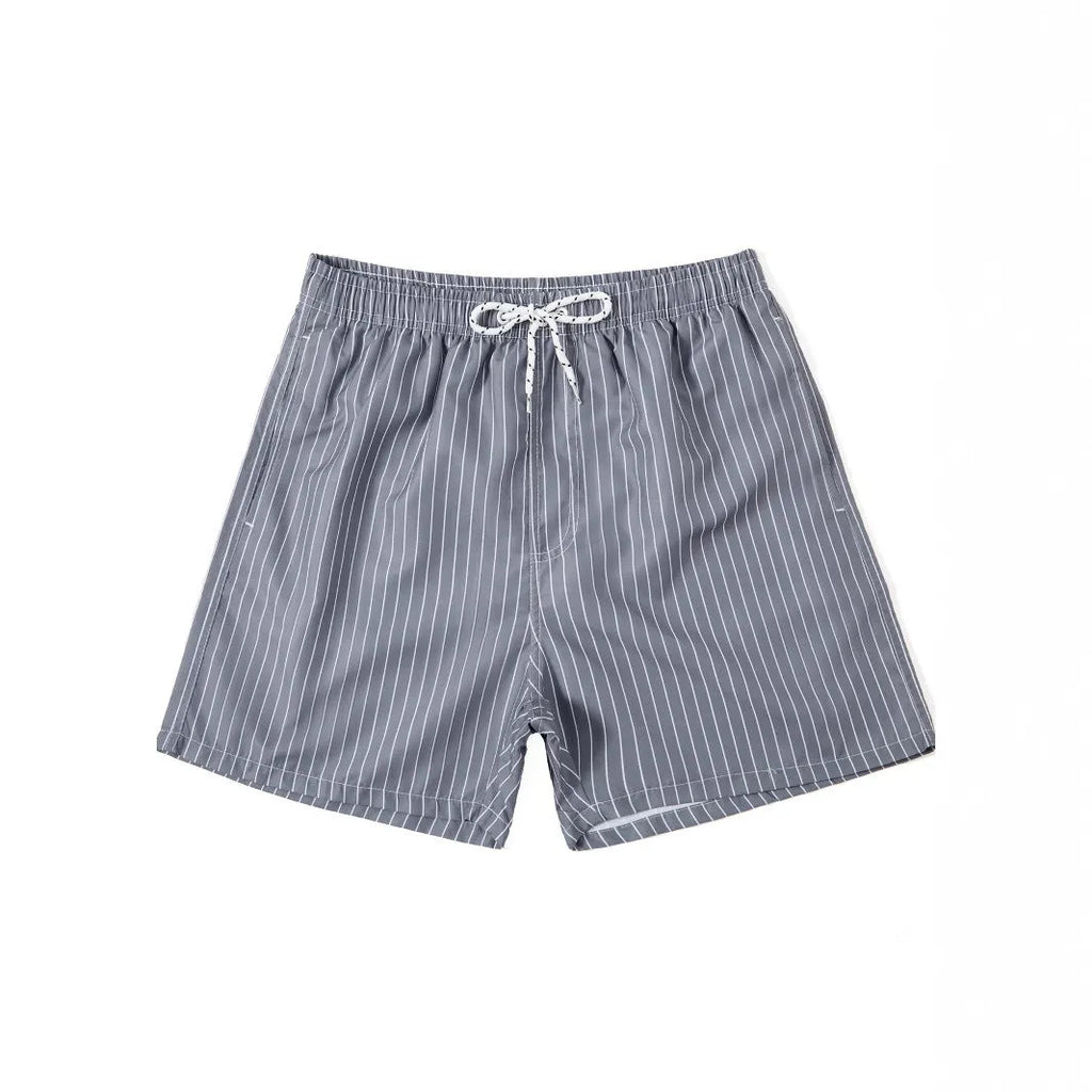 Men's striped beach shorts in navy blue, showing straight leg opening and casual fit.