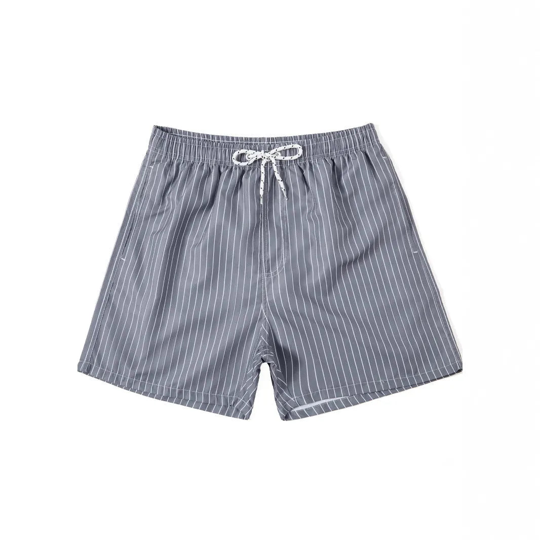 Men's striped beach shorts in navy blue, showing straight leg opening and casual fit.