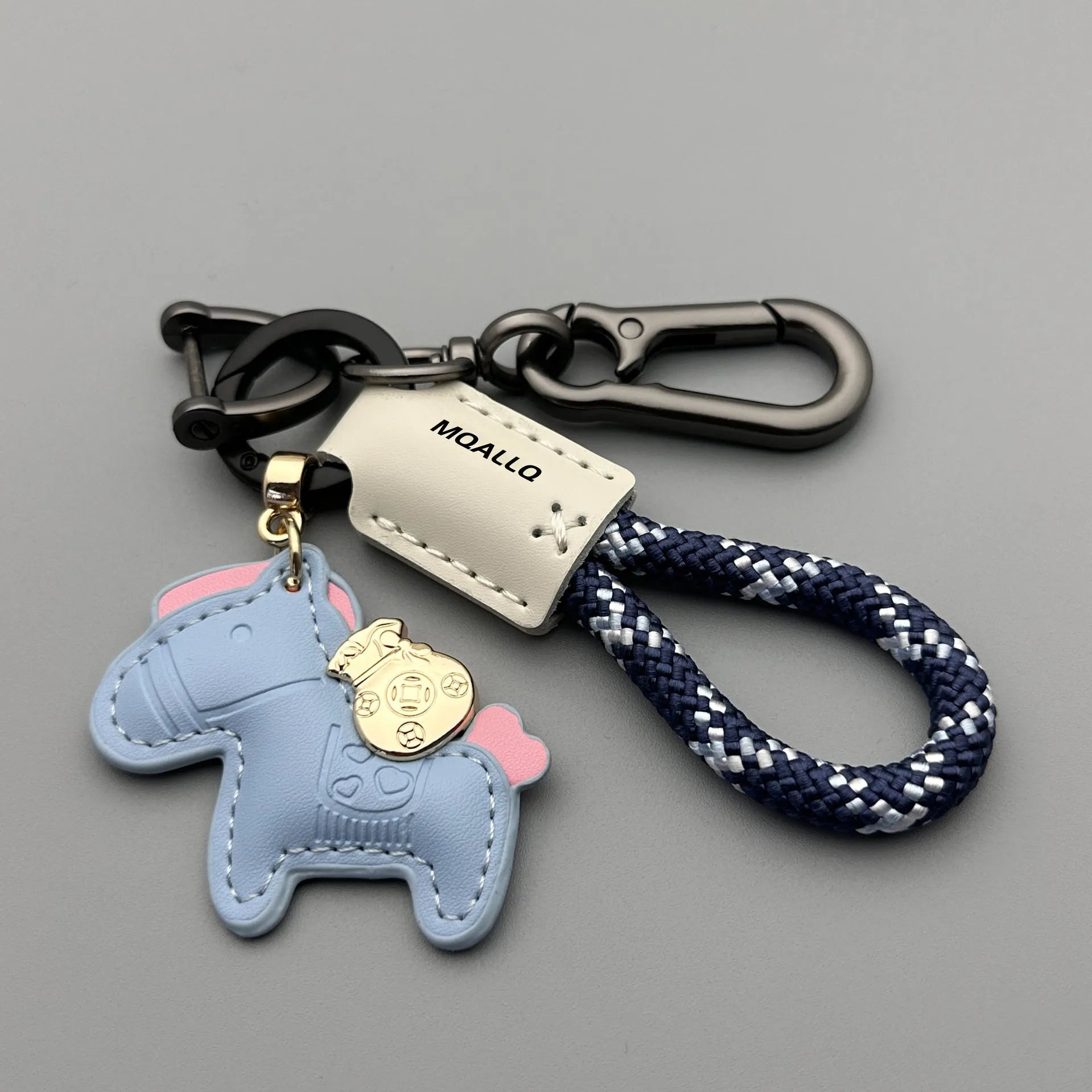 Handmade cowhide leather key ring pendant with zinc alloy pony buckle and coloured flanelle rope.