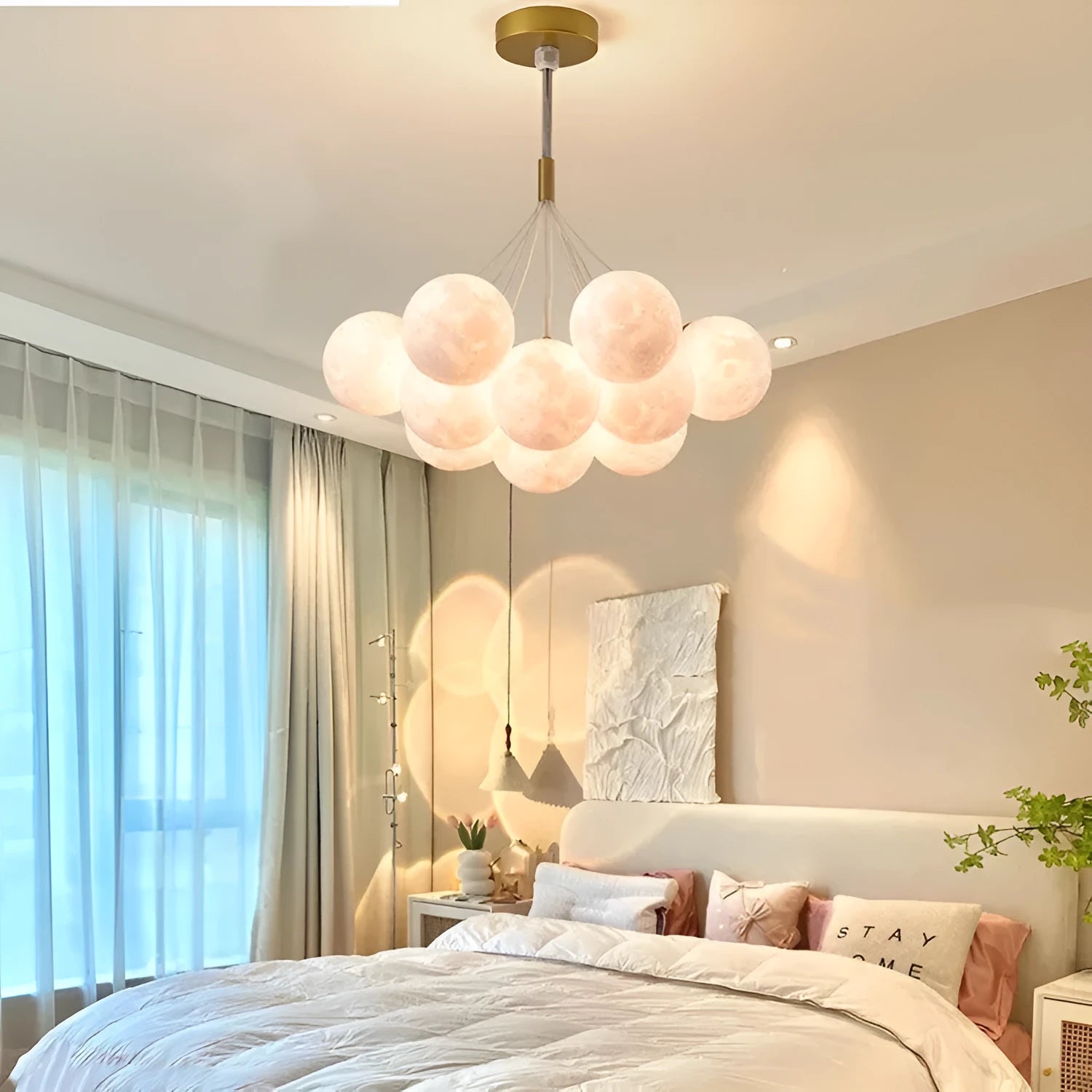 Nordic style gold and black iron LED chandelier with bubble-shaped lights for bedroom or study ceiling.