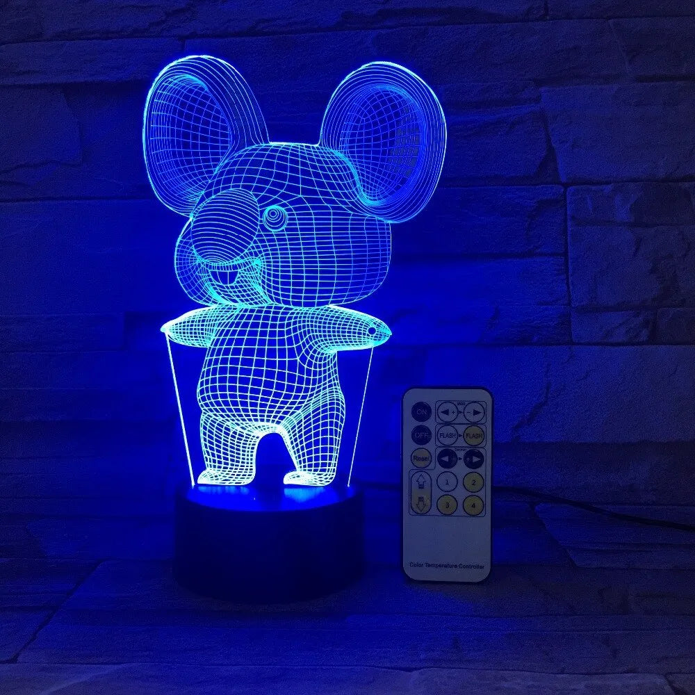 Black koala-shaped LED night light with remote control showing multiple colour illumination options