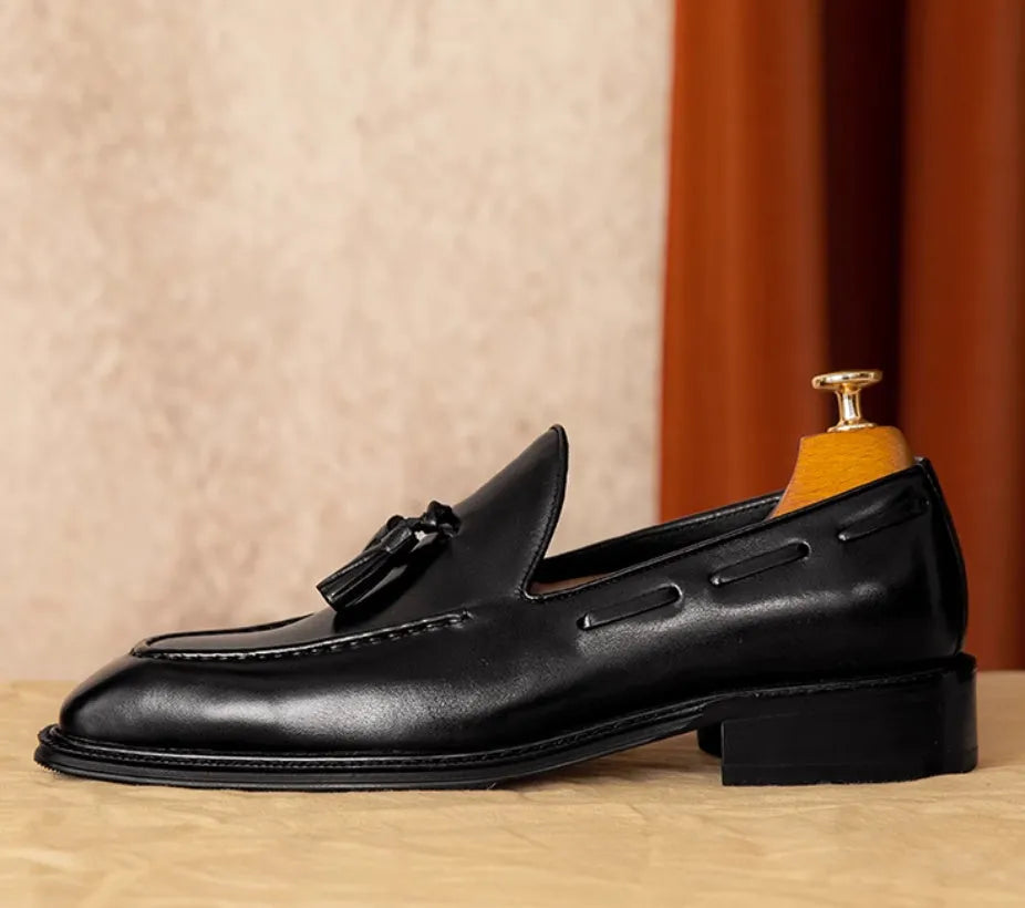 Men's black genuine leather slip-on loafers with fringed detail and rubber sole