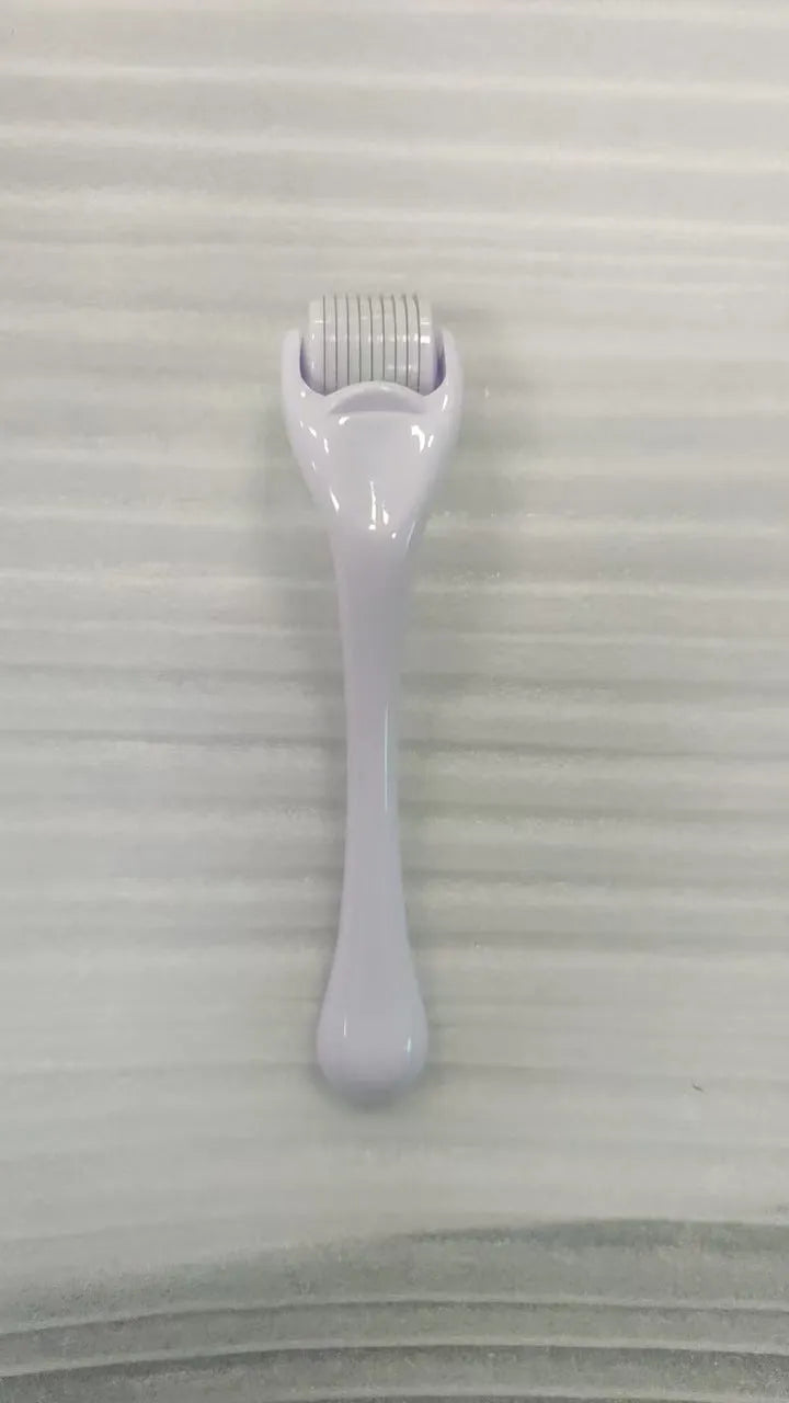 Sterile 540 micro needle derma roller showing handle and needle wheel in assorted colours.