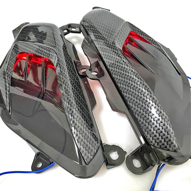 Pair of carbon fibre decorative LED side lamps for Yamaha NMAX125 and NMAX155 scooters.
