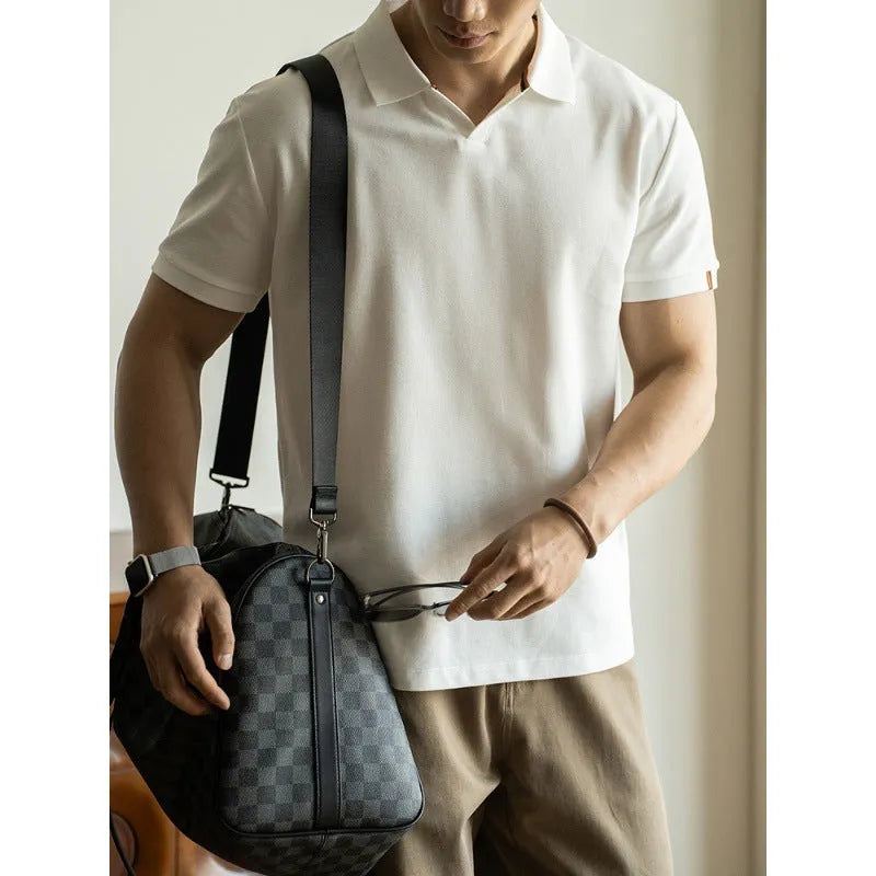 American-style short-sleeved polo shirt in a cotton-polyester blend, shown in blue, black, or white.